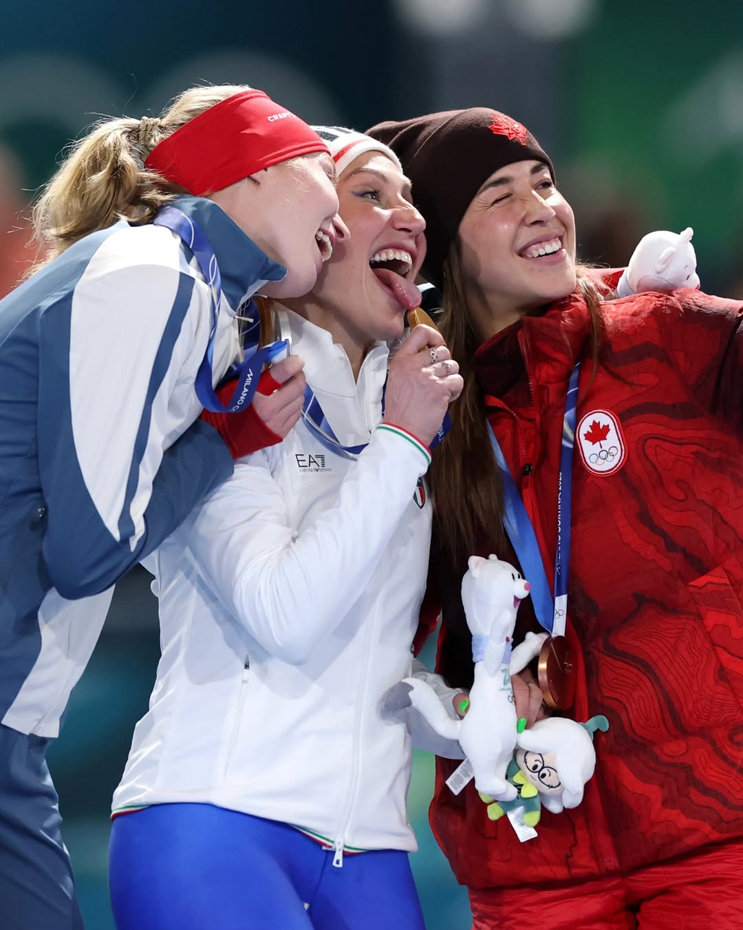 Francesca Rolobrida (center) is delighted after winning the gold medal in the women's 3,000m speed skating at the 2026 Milan-Cortina Winter Olympics at the Ice Skating Arena in Milan, Italy, with a time of 3:54.28. /Photo = TNT Sports SNS Capture