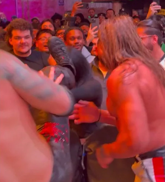 Professional wrestler Charles Mason kicks a female fan in the face. /Photo = The Sun Source