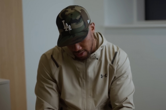 Anthony Joshua is bowing during the interview. /Photo = Anthony Joshua official YouTube video Source