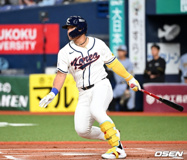 Ahn Hyun-min is scoring an additional RBI with a double that separates the left-field line.