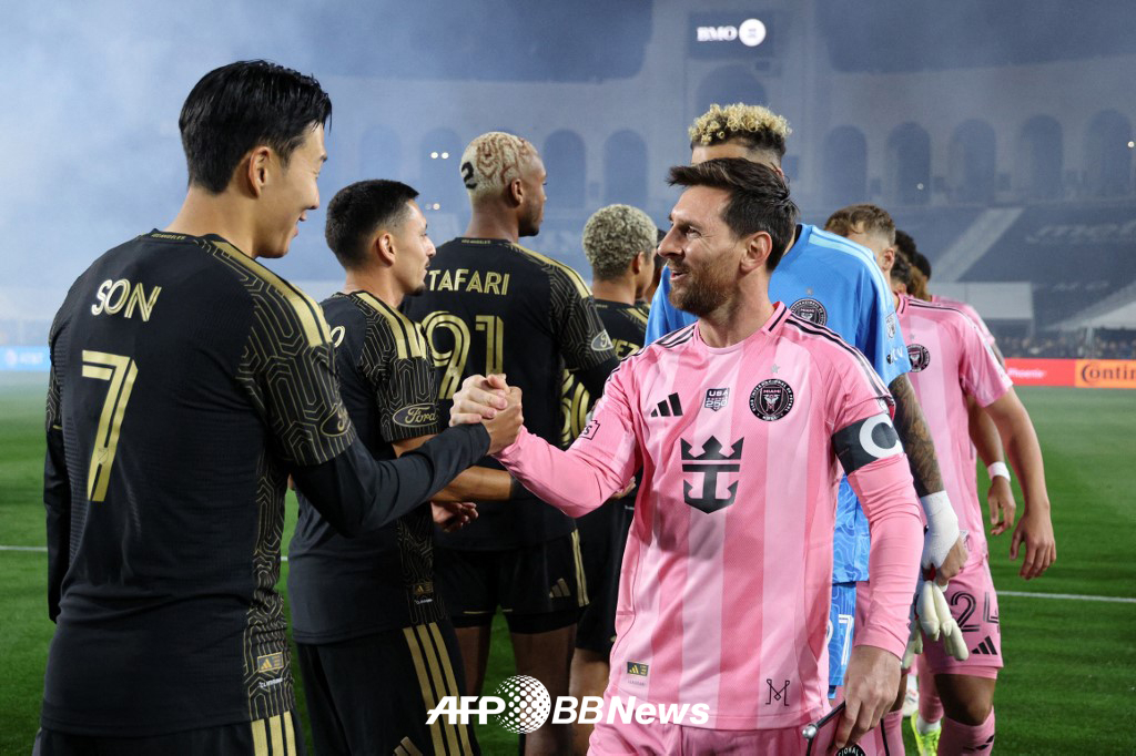 Son Heung-min (left) and Lionel Messi are greeting each other ahead of the opening match of the 2026 Major League Soccer (MLS) last month. /AFPBBNews=News1
