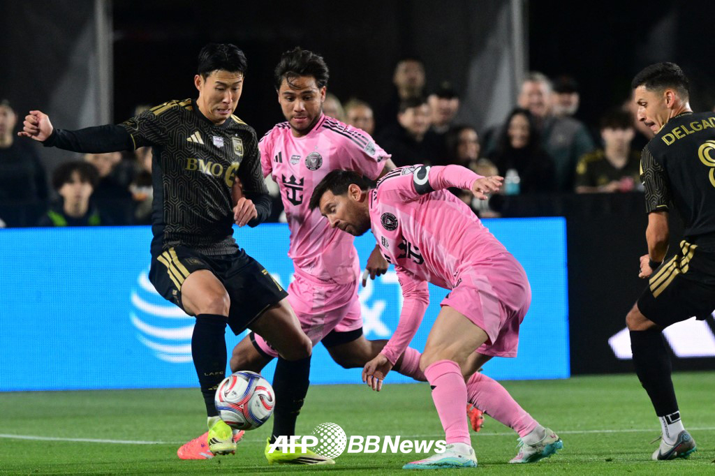 Son Heung-min (left) and Lionel Messi are competing for the ball in the opening game of the 2026 Major League Soccer (MLS) in the U.S. last month. /AFPBBNews=News1