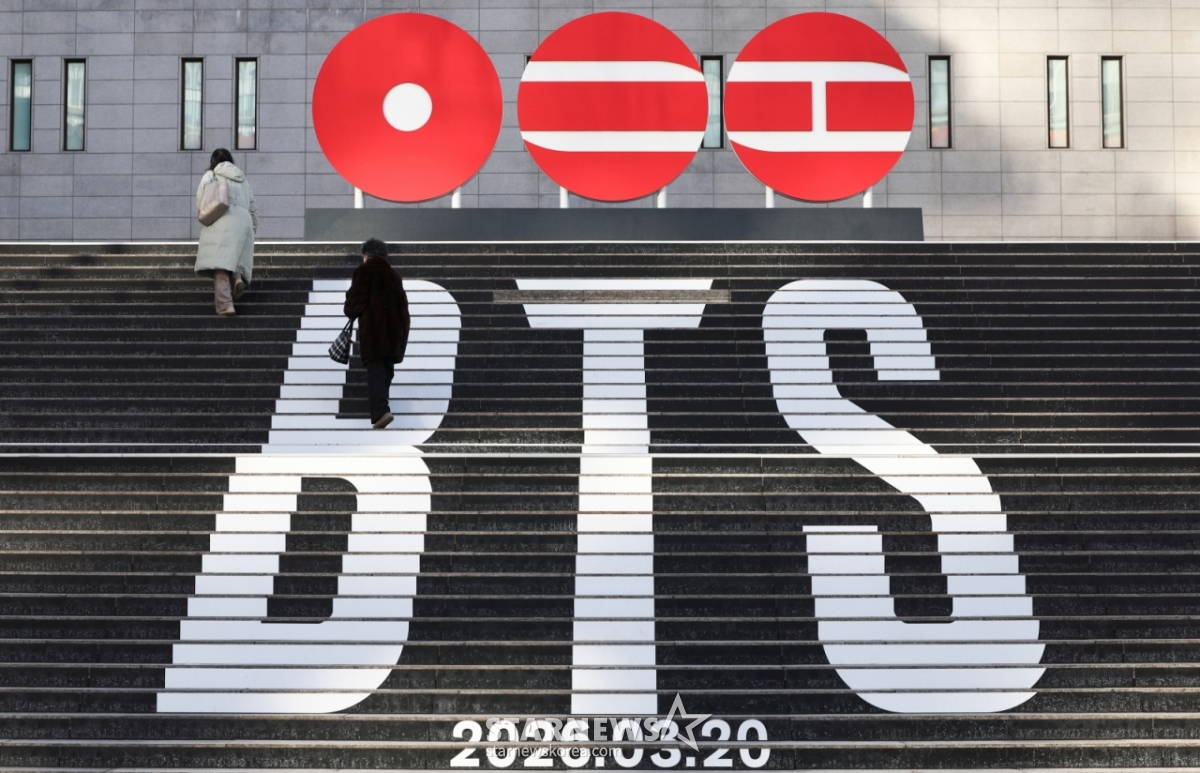 A promotional material is installed on the stairs of the Sejong Center for the Performing Arts in Jongno-gu, Seoul, to announce the comeback of BTS's fifth regular album. /Photo = News 1