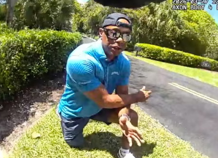 Tiger Woods is on one knee responding to a police investigation.  /Photo = Martin County Sheriff's Office