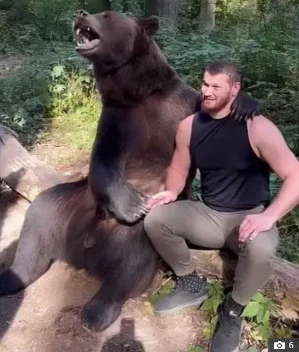 Aslanbeck Mahmudov training with the bear. /Photo = The Sun Source