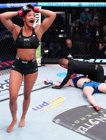 Hayley Cowan, right, falls after being niked by Alice Pereira. /Photo = UFC Image Source