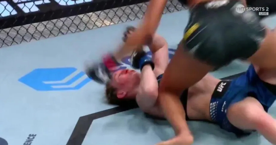 Hayley Cowan (below) is knocked down by Alice Pereira after a knee kick./Photo = The Sun Source, UK