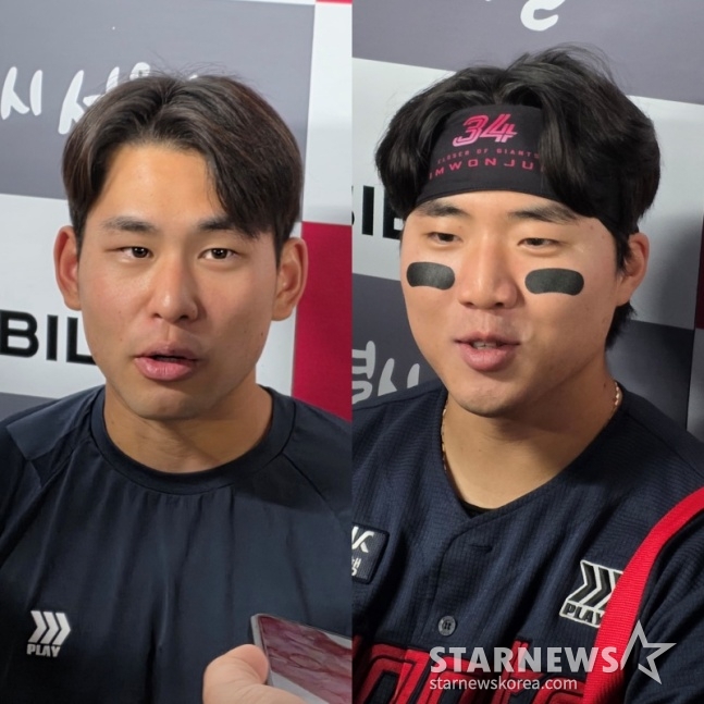15日,乐天队的金镇旭(左)和孙成彬在蚕室带领LG队取得胜利后,正在接受记者的采访。 =照片=金东润。