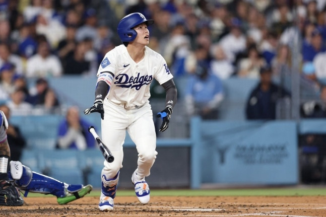 他就是洛杉矶道奇队的金惠成。 =法新社BBNews=新闻1。