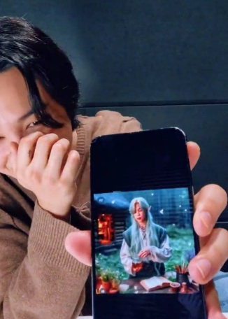 Jimin showcasing fan art with long hair