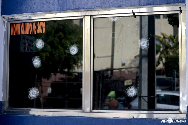 A view showing bullet holes in a window. /AFPBBNews=NEWS1