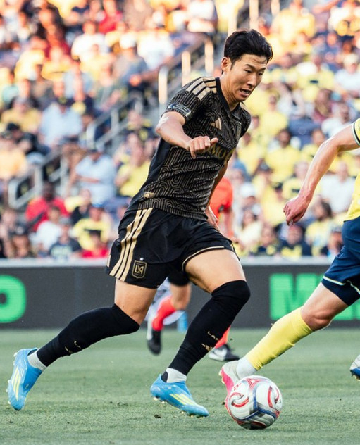 LAFC forward Son Heung-min is seen dribbling past defenders during an away match against Nashville at Geodis Park in Nashville, Tennessee, USA, on the morning of the 18th (Korean time) for the '2026 Major League Soccer (MLS)'. /Photo=LAFC official SNS archive