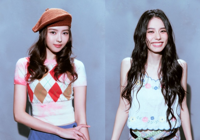I.O.I's Nayoung (left) and Sohye. /Photo=Doosan Bears