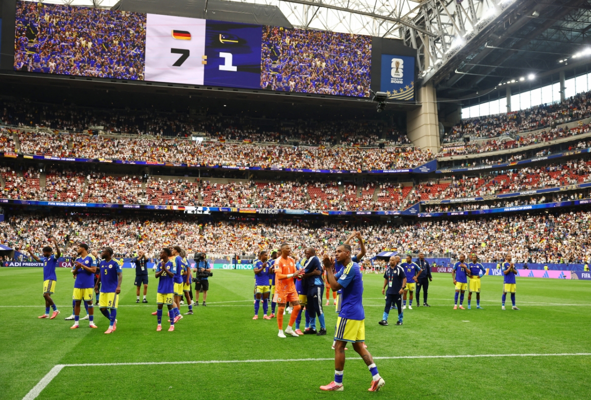 Curaçao, the nation with the smallest population (150,000) among all countries to have ever qualified for a World Cup finals, greets the crowd after suffering a 1-7 defeat to Germany in their first-ever World Cup match. /Reuters=NEWS1