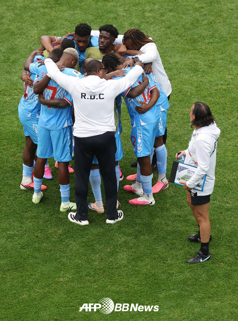 DR Congo players celebrate after recording their first-ever World Cup point on the World Cup stage in 52 years. /AFPBBNews=NEWS1