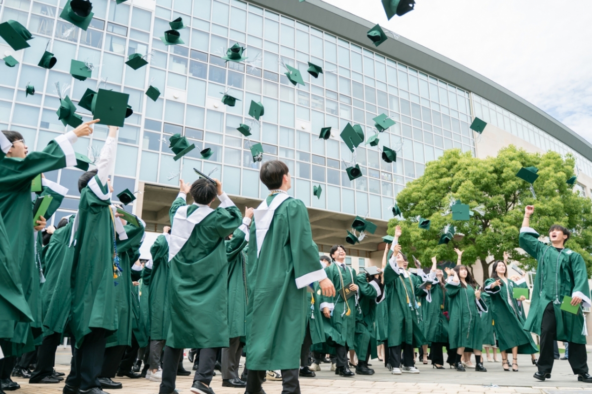 Students graduating from Saint Johnsbury Academy Jeju (SJA Jeju) in 2026 celebrate their graduation by tossing their caps into the air. / Photo provided by SJA Jeju