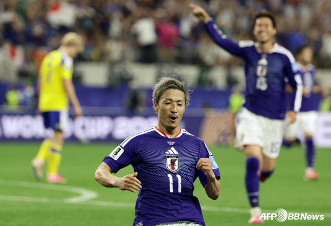 Japan attacker Daizen Maeda's goal celebration. /AFPBBNews=NEWS1