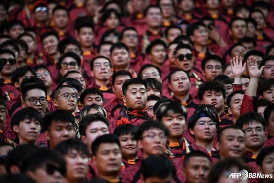Chinese fans watch the final match of the 2026 FIFA North, Central America and Caribbean third-round qualifiers held at Longxing Football Stadium in Chongqing, China. /AFPBBNews=NEWS1