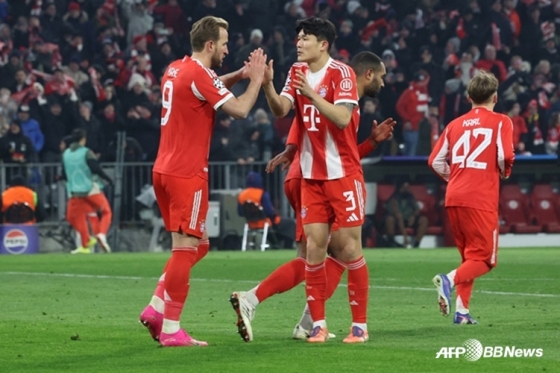 Harry Kane (left) and Kim Min-jae. /AFPBBNews=NEWS1