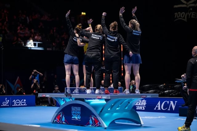 The Romanian women's Tak Gu (CEO) team climbed onto the table tennis table immediately after securing the bronze medal. /Photo=International Table Tennis Federation official SNS