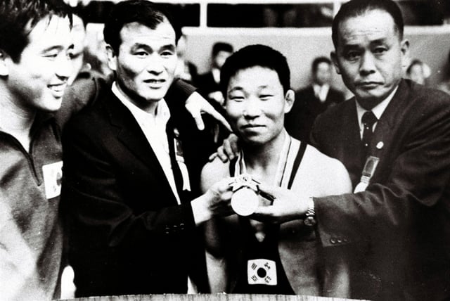 Image of the late Jang Chang-seon (second from the right) when he won a silver medal in freestyle bantamweight wrestling at the 1964 Tokyo Olympics. /Photo=Korea Sports Council provided
