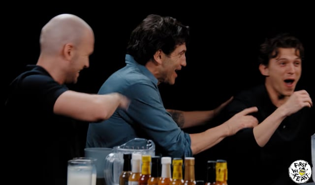 Tom Holland vomiting, followed by the cast reacting in surprise. Photo: Screenshot from YouTube 'Hot Ones' video