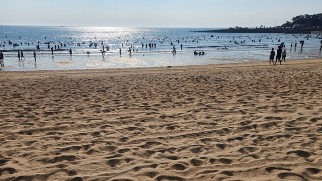 The expansive white sandy beach of Eulwangri Beach