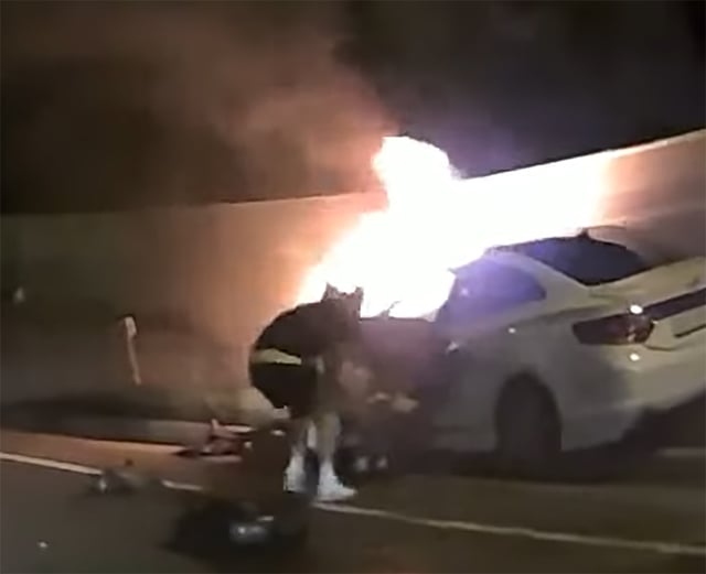 Gwangju FC's Shin Chang-moo and Friedyonsen approaching a vehicle with flames rising from a traffic accident to rescue the driver. /Photo=Screenshot of whistleblower video from YouTube Han Moon-chul TV