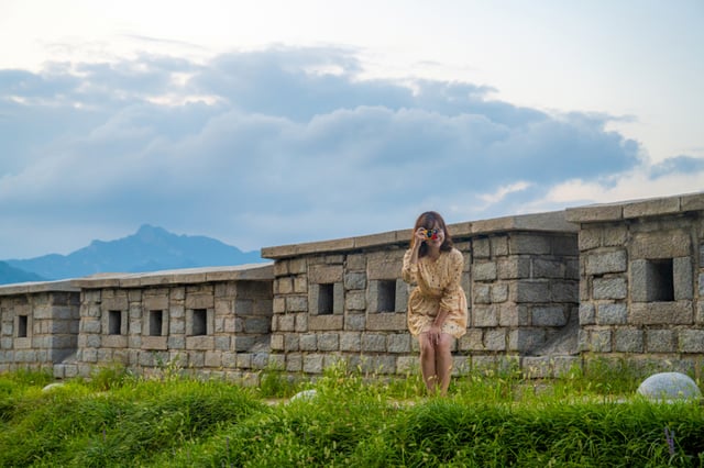 Snap photo with Naksan Fortress in the background.