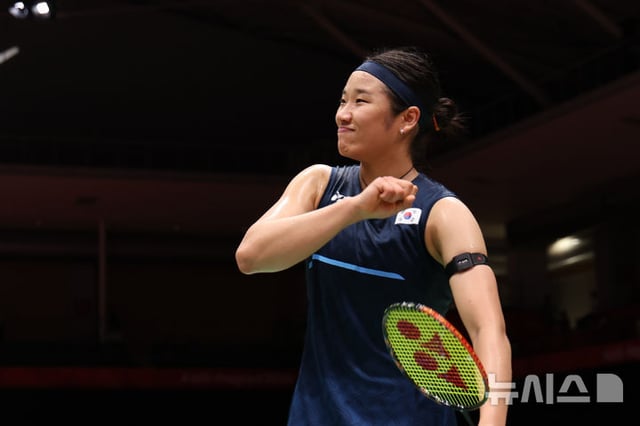 At the 2026 Aichi-Nagoya Asian Games women's team badminton quarterfinals between South Korea and Malaysia held at Ichinomiya City Comprehensive Gymnasium in Aichi Prefecture, An Se-young celebrates after winning the second set. /Photo=NEWSIS