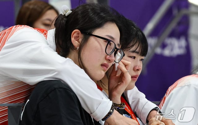 South Korea's Yang Ji-in and Oh Ye-jin look disappointed after being eliminated from the preliminary round of the women's 25m pistol shooting event at the 2026 Aichi-Nagoya Asian Games, held on the 28th at the Aichi Prefecture General Shooting Range in Toyota City, Japan. /Photo=NEWS1