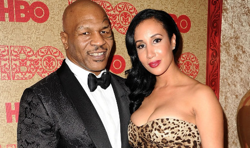 Mike Tyson (left) and his wife. /Photo=The Sun
